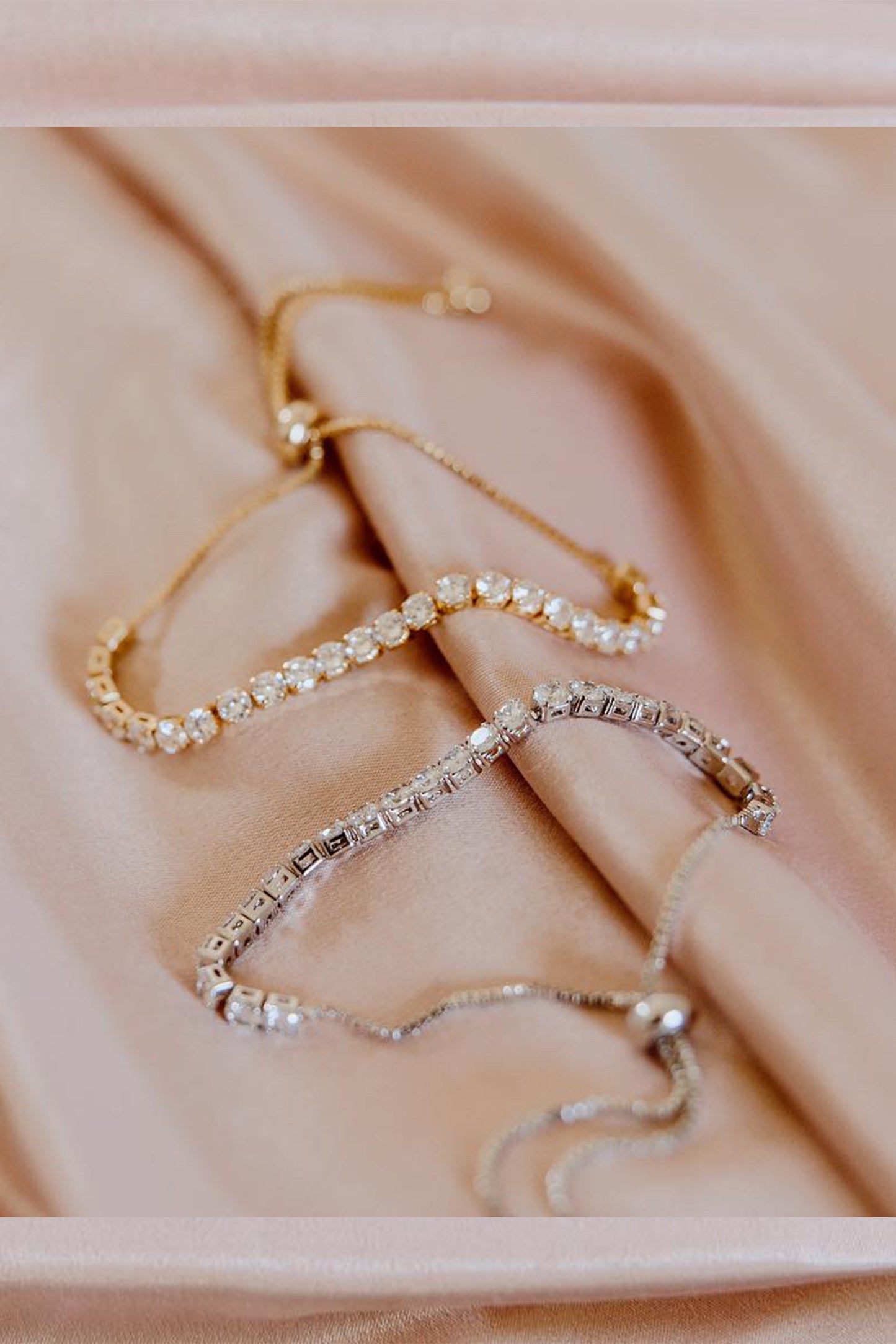 Close-up of delicate women’s chain bracelet in gold and silver modern minimalist design