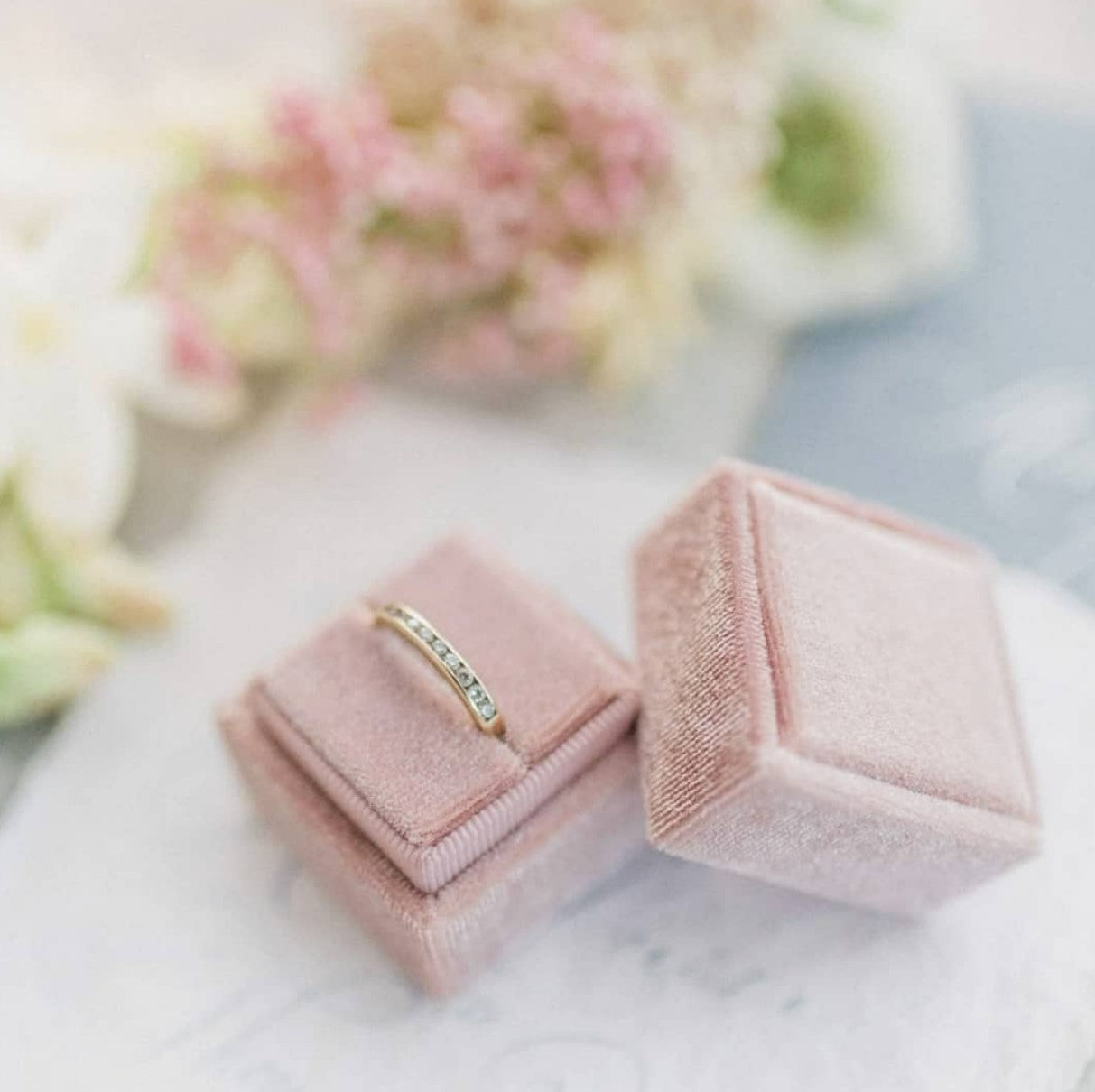 Open and closed square velvet ring box showing plush interior and elegant exterior finish.