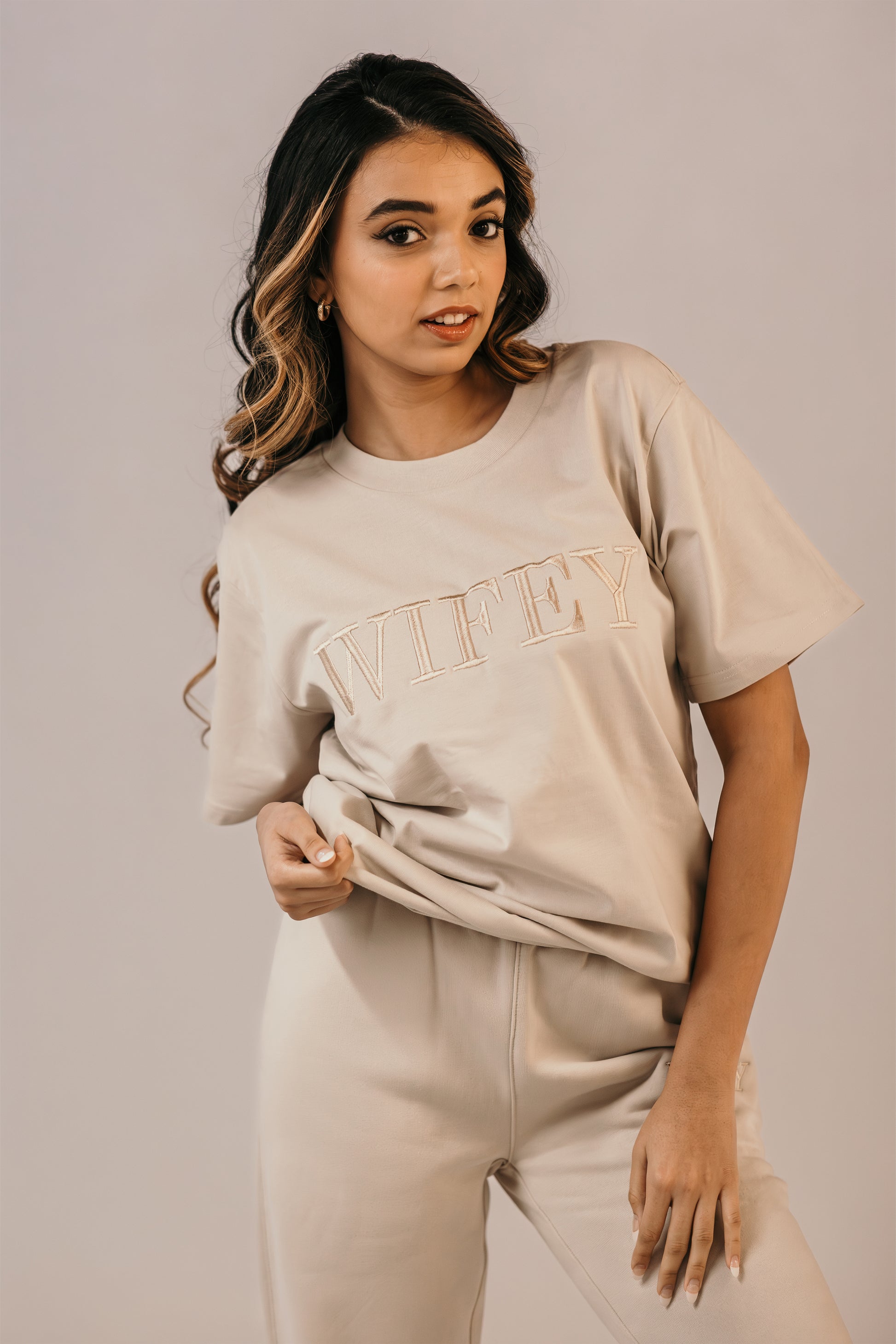 Bride wearing wifey tee bone colour champagne embroidery Missosca Australia