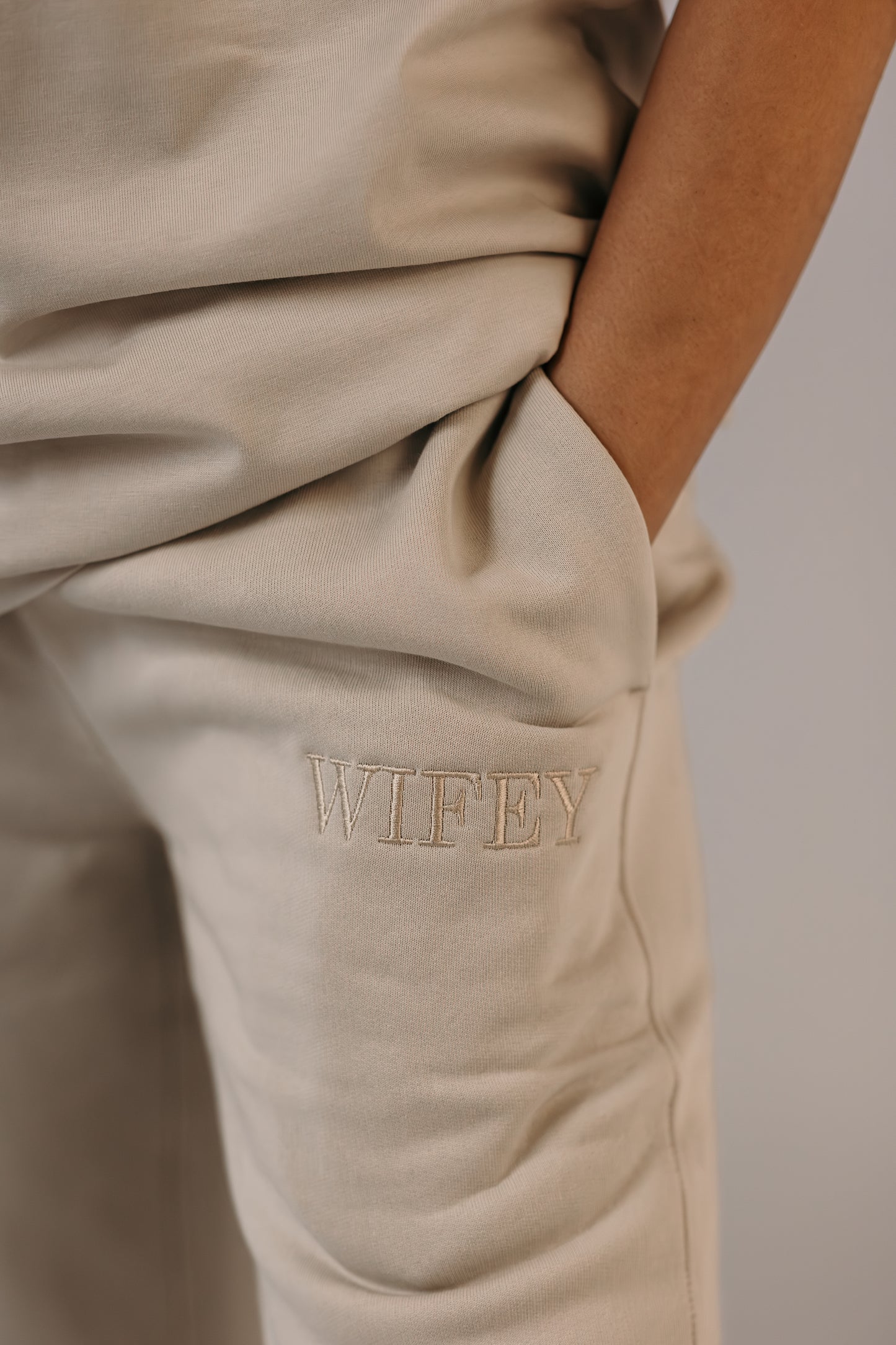 Bride wearing wifey track pants bone colour champagne embroidery Missosca Australia