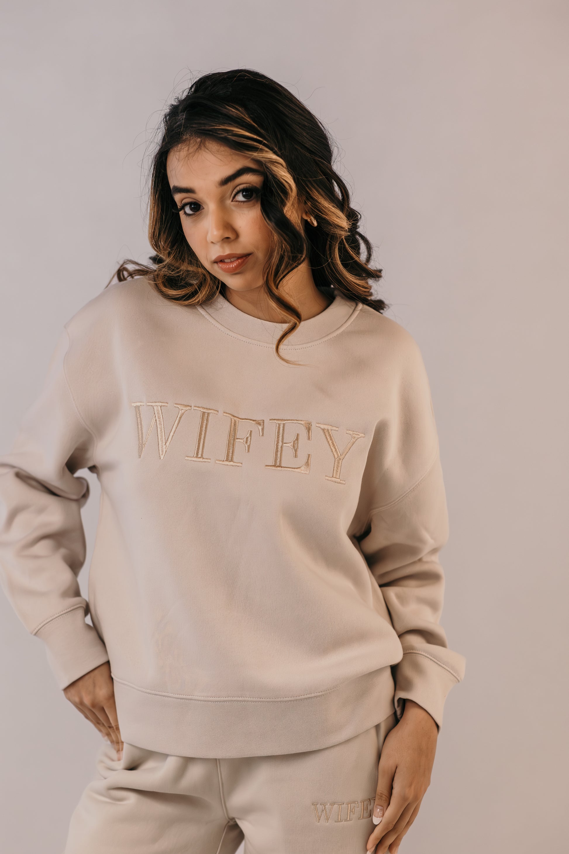 Bride wearing wifey crew sweater relaxed fit bridal loungewear outfit