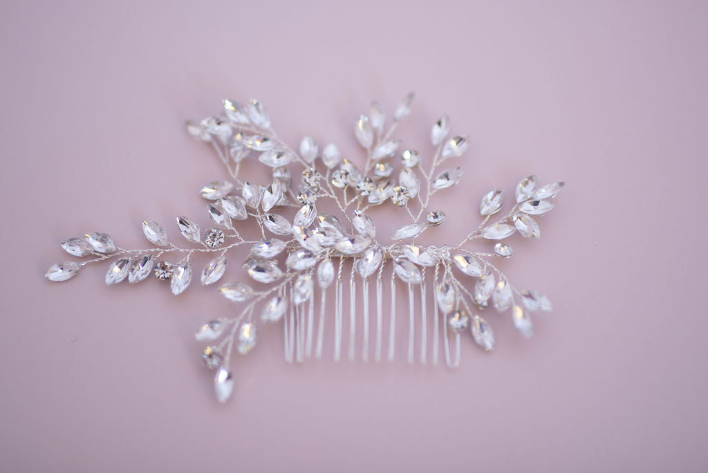 Elegant crystal hair comb showing delicate floral detailing and refined design.