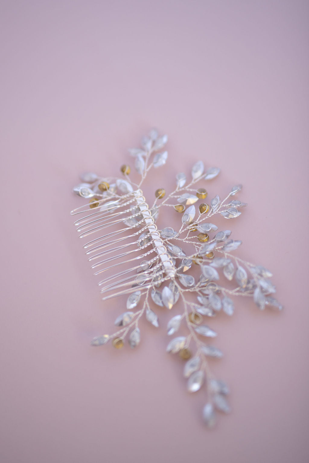 Close-up of crystal bridal hair comb highlighting intricate sparkle and craftsmanship.

