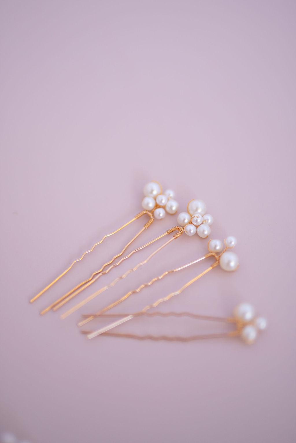 Side view of pearl bridal hair comb showing curved design and pearl detailing