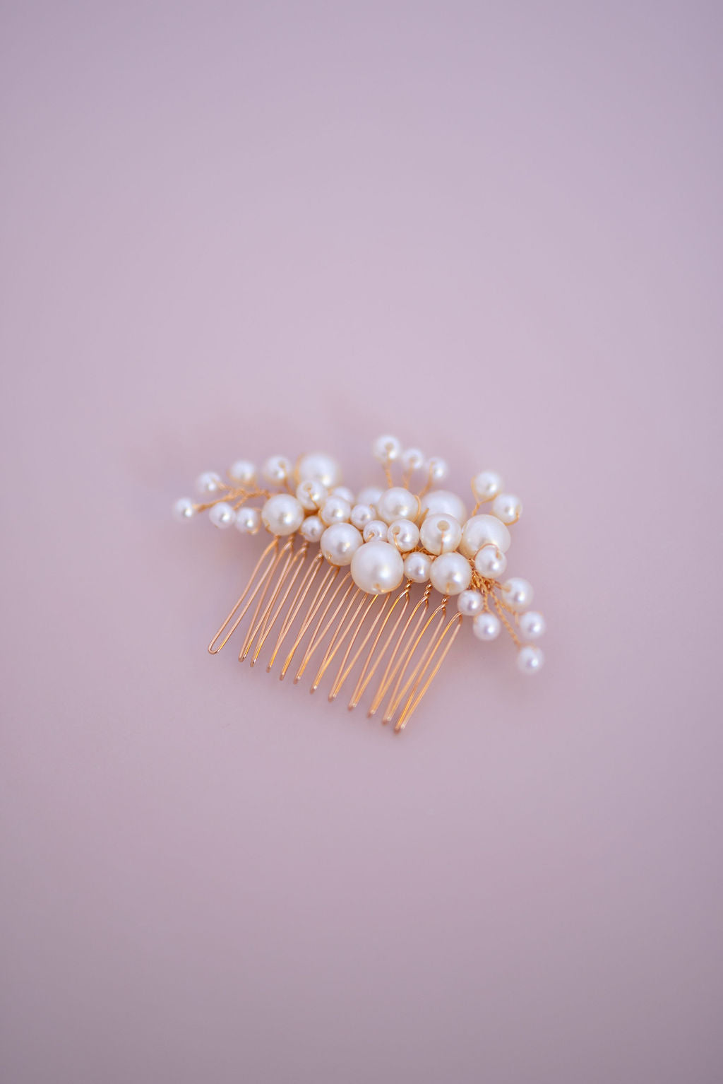 Close-up of pearl wedding hair comb highlighting fine craftsmanship