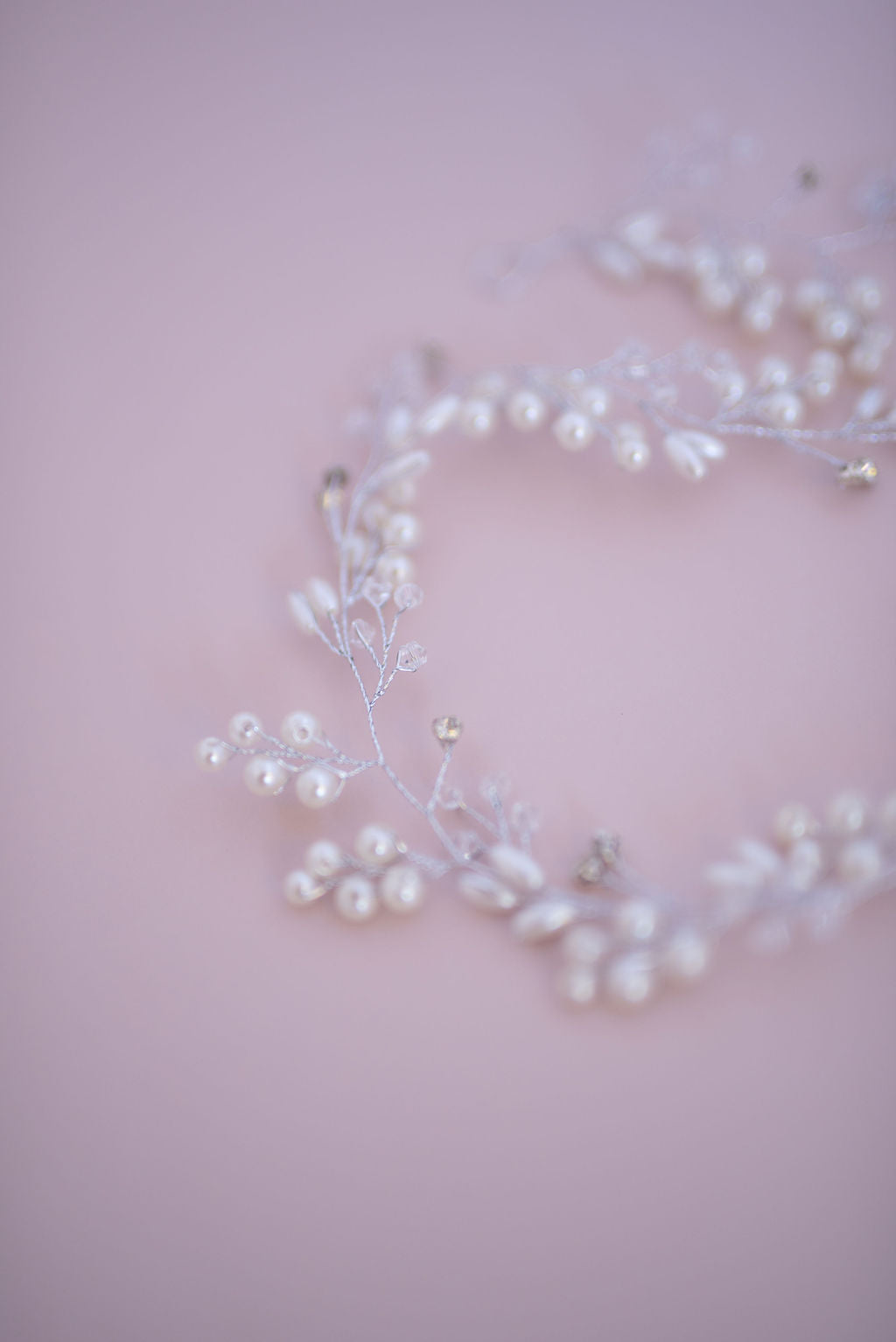 Silver wedding hair vine styled in circular layout showing full length design.