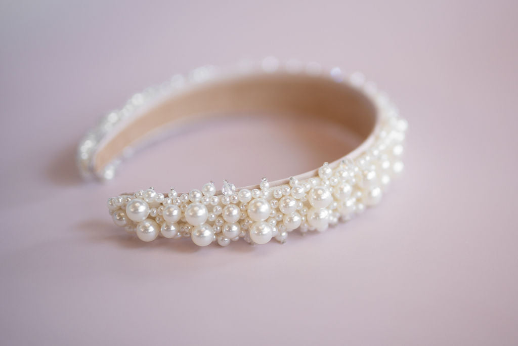 Close-up pearl wedding headband with hand-set faux pearls for formal hair styling