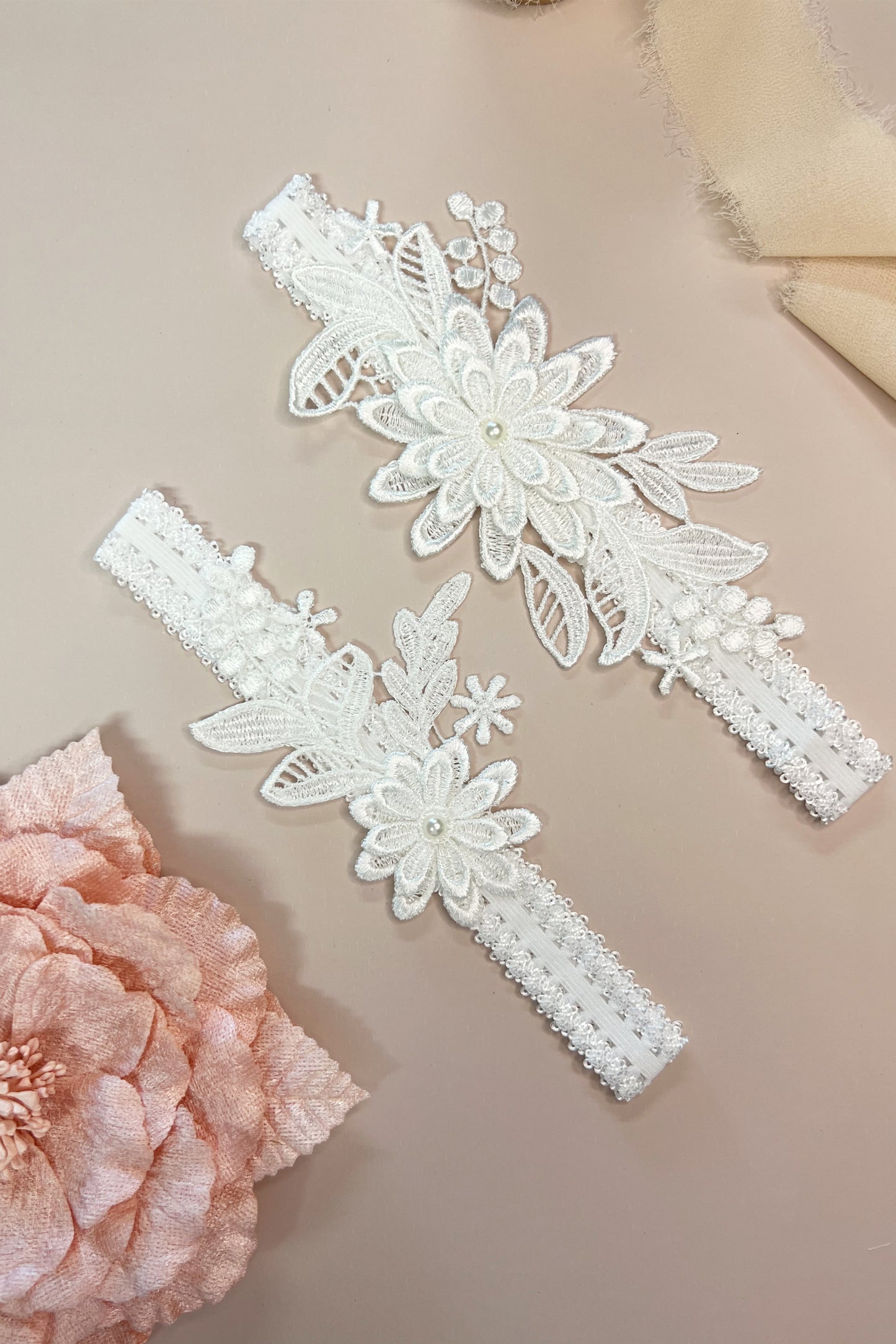 Close-up of floral lace bridal garter set showing delicate detailing and soft stretch design.