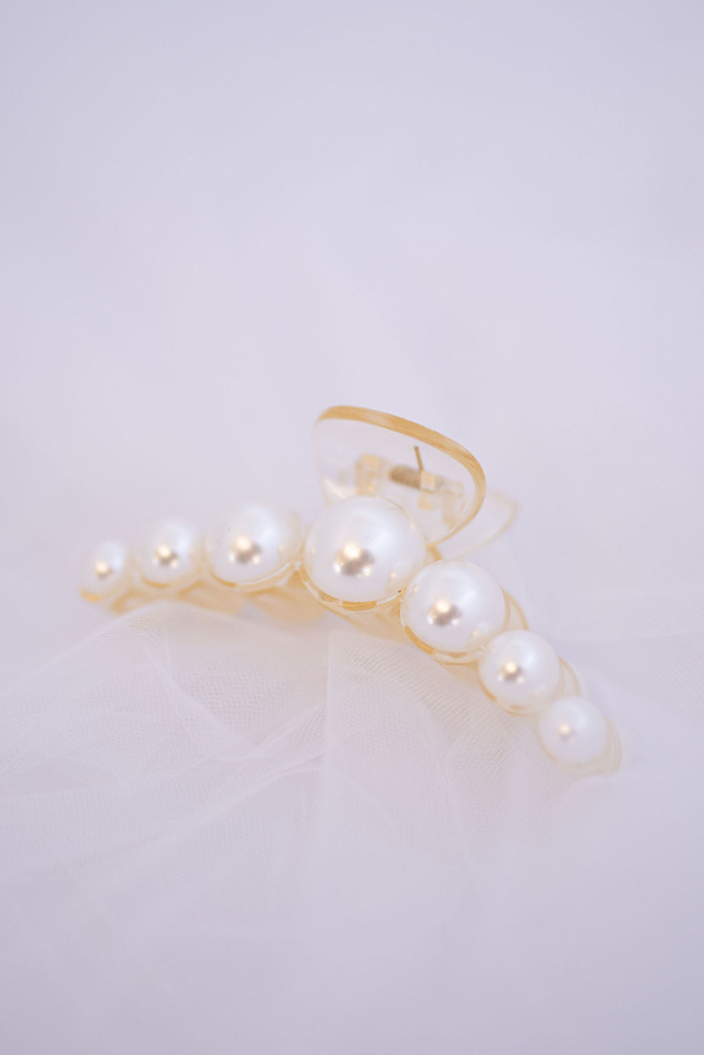 Medium pearl hair clip featuring elegant faux pearls, perfect for wedding hairstyles.