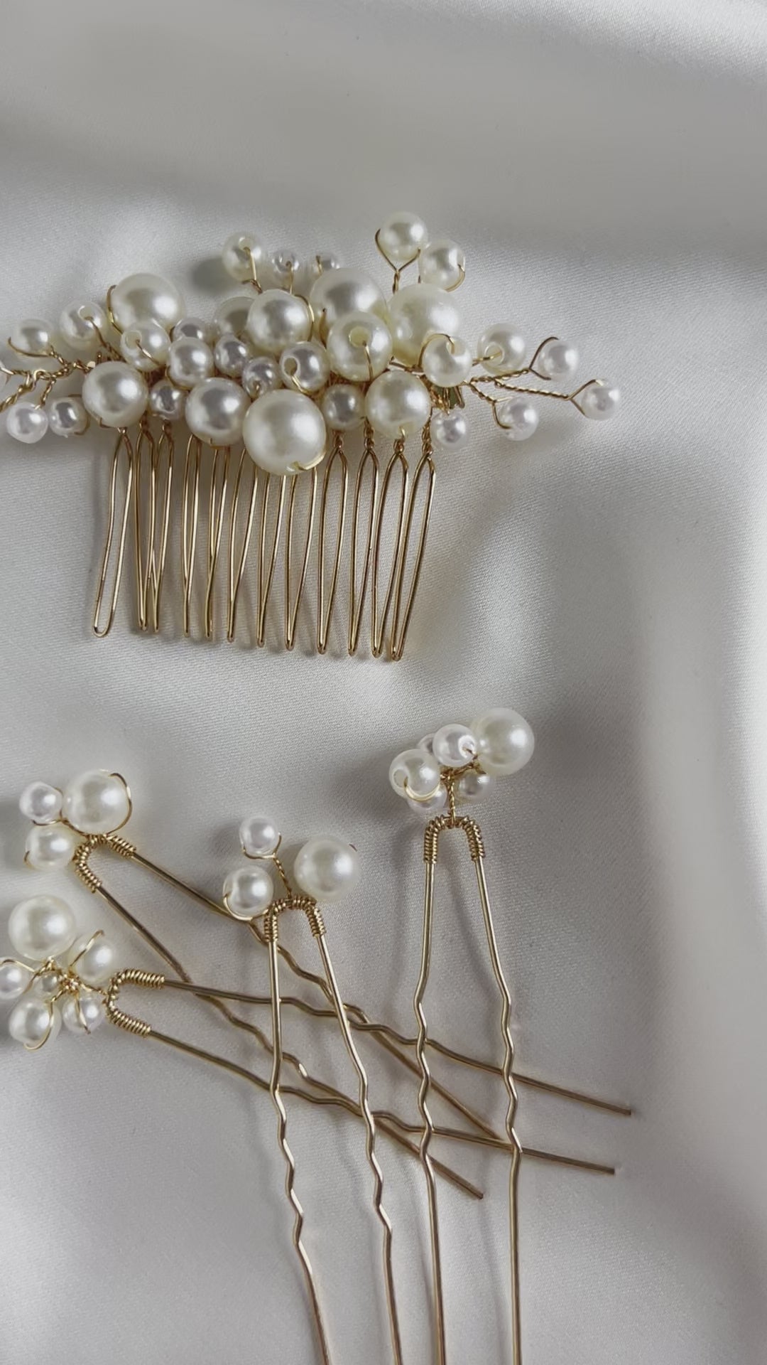 Pearl bridal comb photographed on satin fabric for elegant product styling