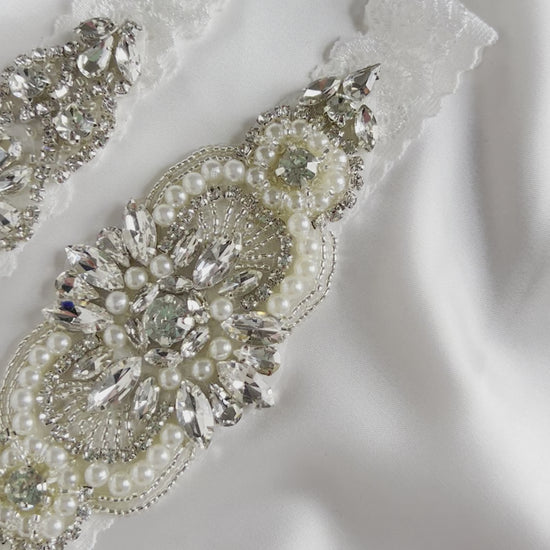 Bridal garter set showcasing elegant pearl and diamante detailing for wedding day styling.