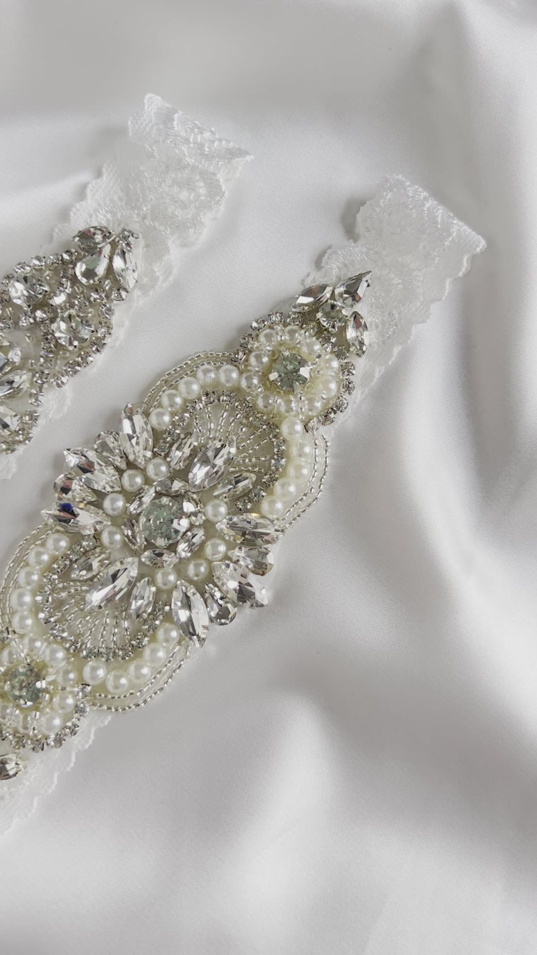 Bridal garter set showcasing elegant pearl and diamante detailing for wedding day styling.