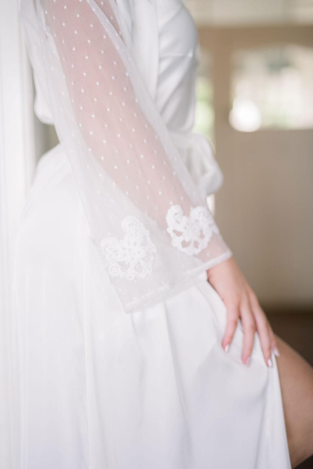 Close-up of lace sleeve detail on Ava full length satin bridal robe